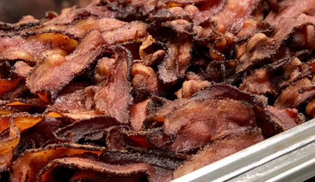 chafer of bacon at a corporate breakfast meeting