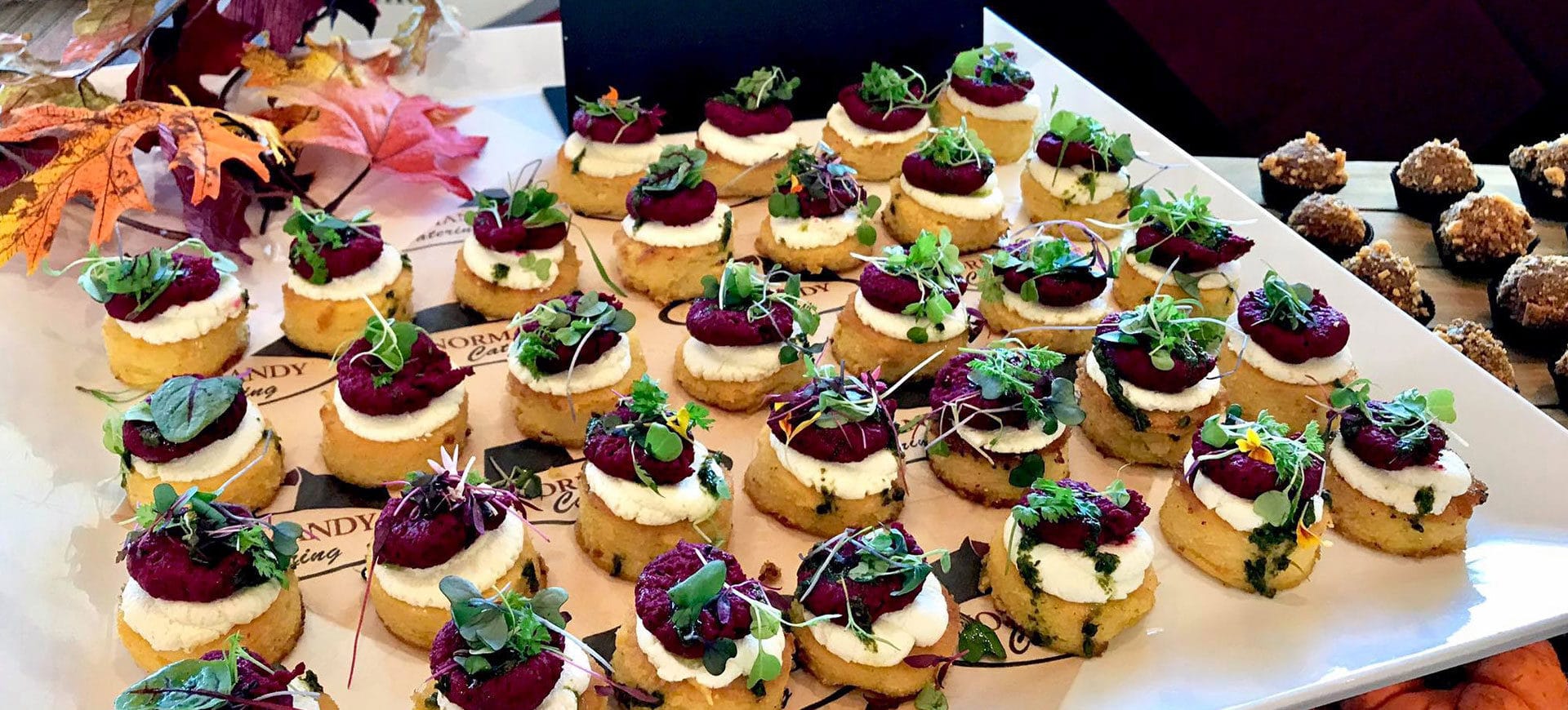 Polenta Pancake (roasted beet hummus & honey goat cheese) by Normandy Catering
