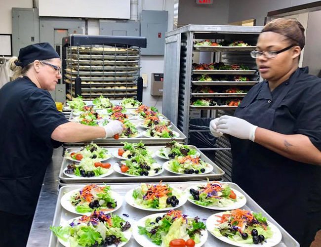 salads being made by the Normandy Catering culinary team